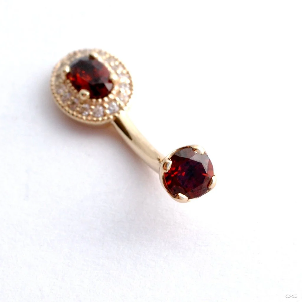 Oval Halo Curved Barbell in Gold with Garnet & Clear CZ from BVLA - Image 2